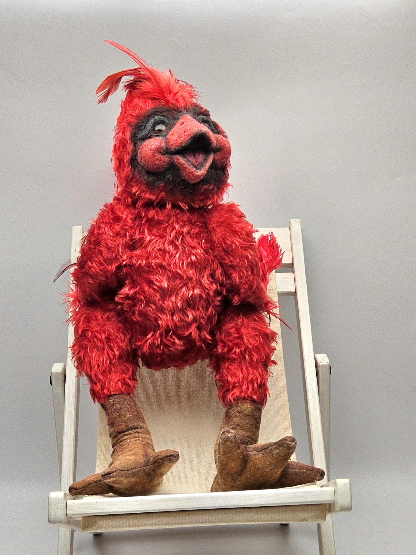 Red cardinal stuffed character with feathers