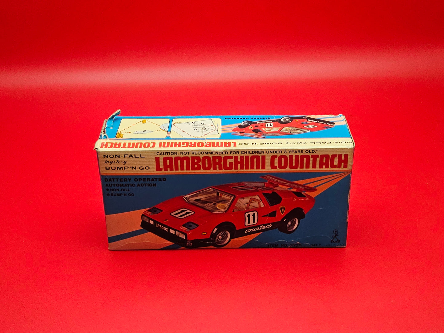 Vintage Lambourghini Countach bump and go tin plate car with original box (not working)