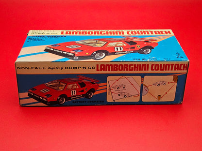 Vintage Lambourghini Countach bump and go tin plate car with original box (not working)