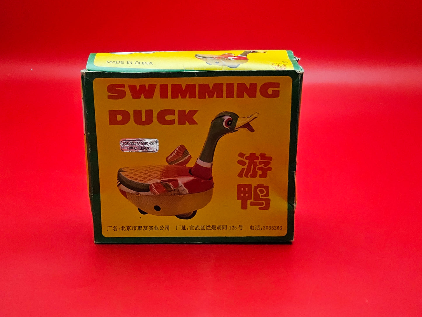 Tin plate swimming duck wind up toy