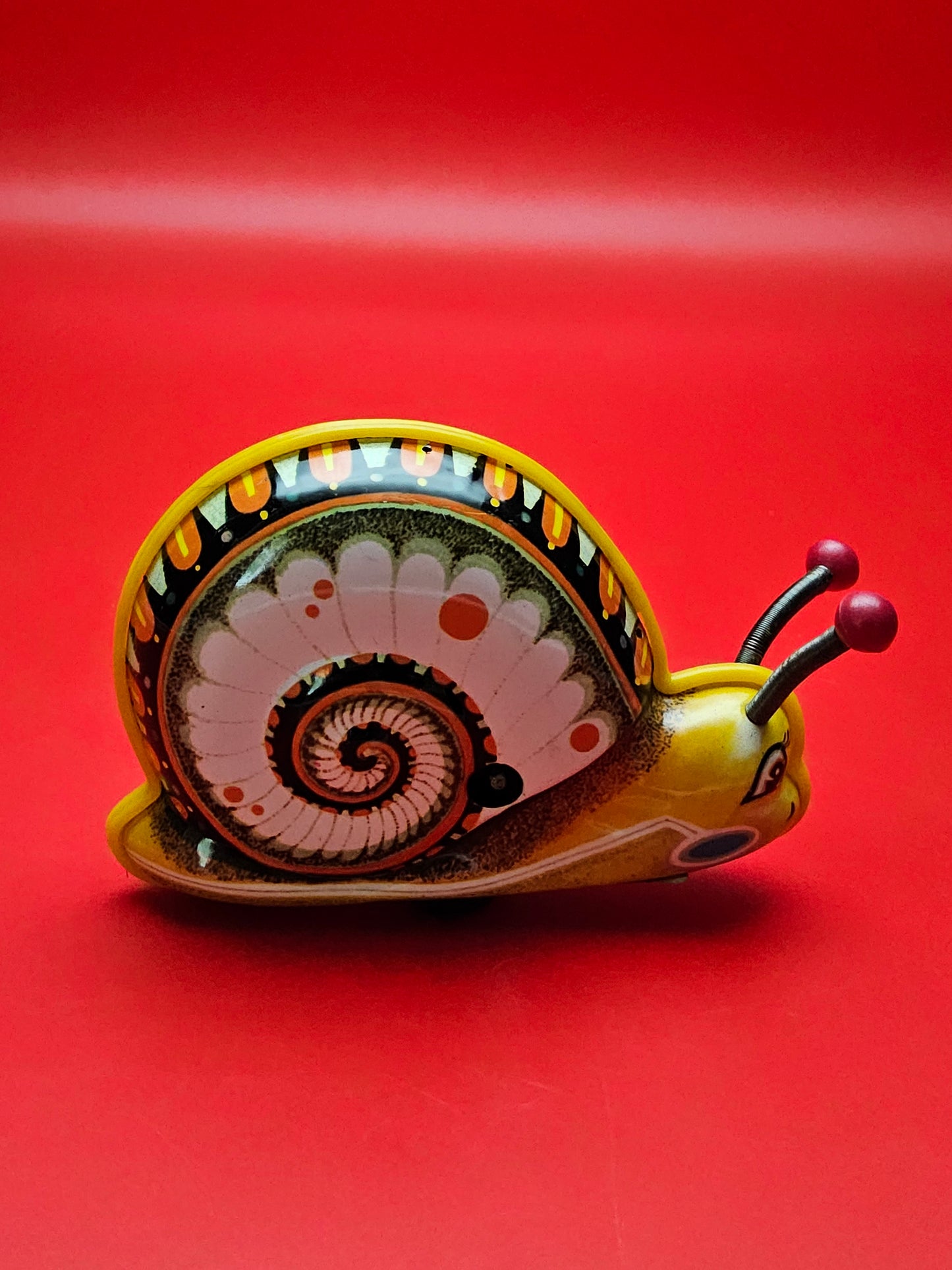 Vintage tin litho wind up snail with original box in working order