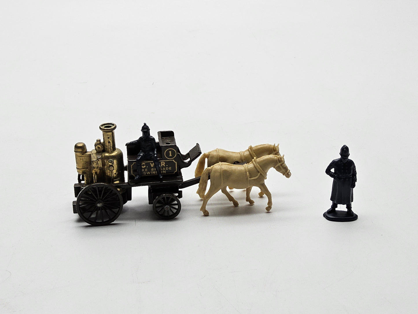 Lledo horsedrawn fire engine with additional man.