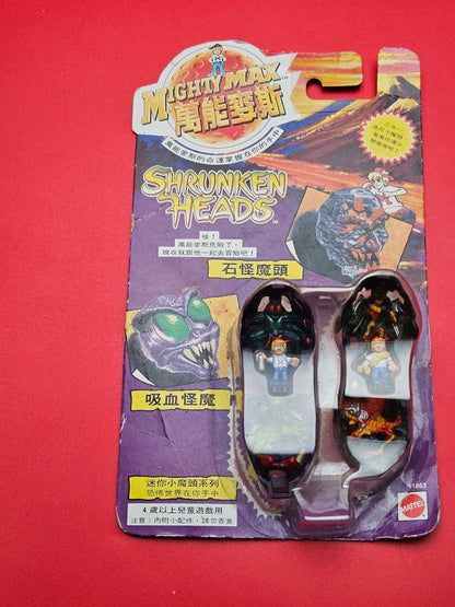 Mighty max shrunken heads sealed in original packaging