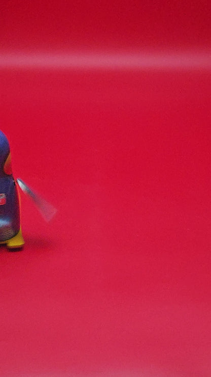 Tin plate skiing penguin with original box